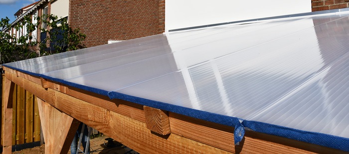 Materiaal voor het dak van uw overkapping: glas of kunststof?